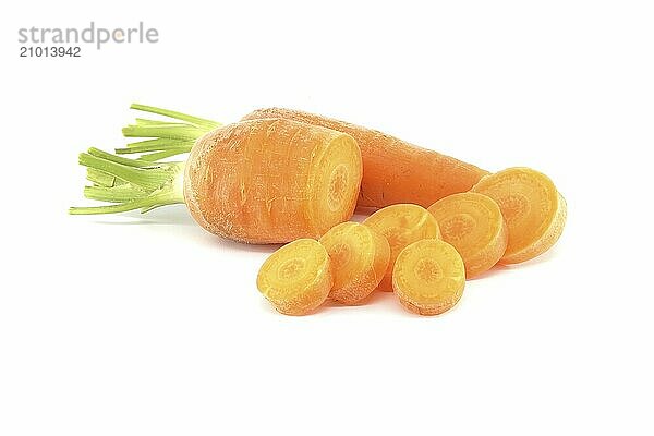 Whole carrot and sliced pieces  all with a bright orange color isolated on a white background