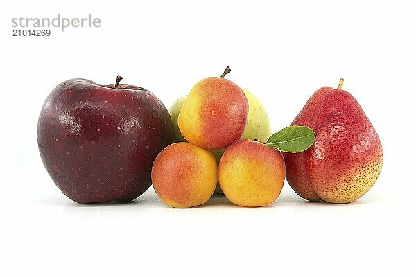 Whole ripe apricots  multicolored pear  red and green apples isolated on a white background. Multivitamin and juicy rich fruits