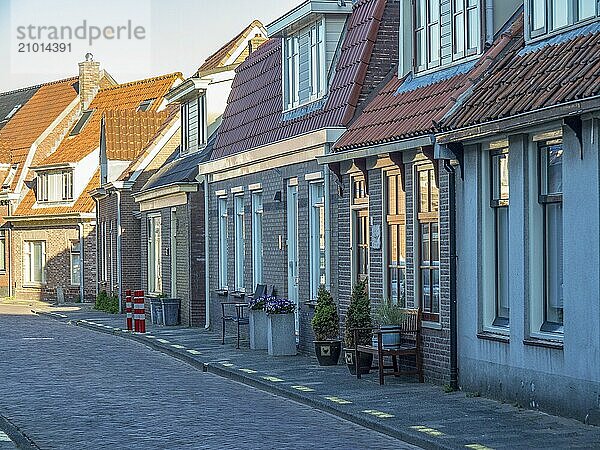 Row of traditional houses on a cobbled street  egmond aan zee  the netherlands