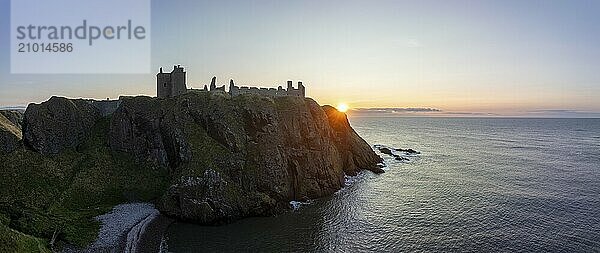 Dunnottar Castle  castle ruins at sunrise on the cliffs  drone shot  Stonehaven  Aberdeenshire  Scotland  Great Britain