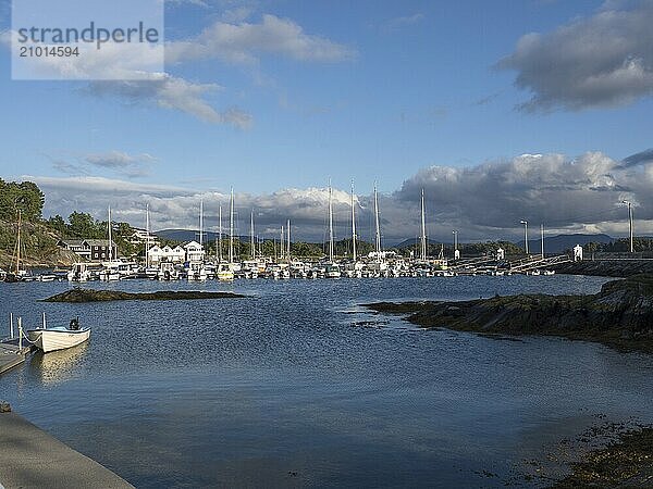 Sailboats and motorboats moored in the harbour at Vinnesholmen in Björnafjorden  Norway  Europe