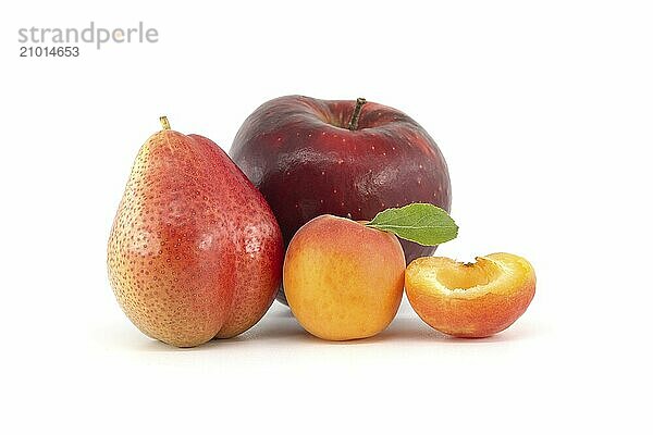 Whole ripe apricots  multicolored pear and apple isolated on a white background. Multivitamin and juicy rich fruits