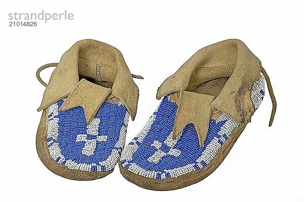 Beaded North American Indian moccasins cut out on white