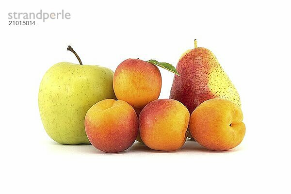 Whole ripe apricots  pear and green apple isolated on a white background  various fruits for a multivitamin mix