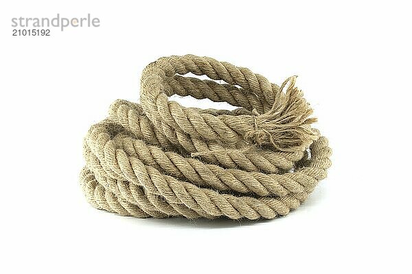 Coil of rope made of hemp or jute  braided texture and consistent thickness with a deep beige color isolated on white background