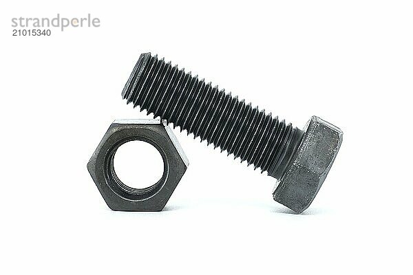 Black metal hexagonal bolt and nut shown in close-up isolated on white background