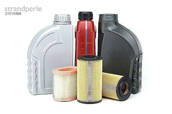 Vehicle engine oil filters elements and motor oil cans isolated on a white background. Containers  plastic storage or oil and filter replacing maintenance