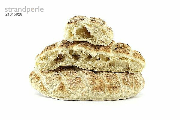 Stack of round pita flat-breads isolated on a white background  pita bread has a pocket and is cut open  showcasing their soft interior