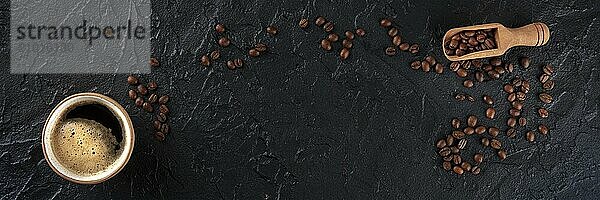 Coffee cup and beans panorama  overhead flat lay shot on a black background with copy space  a panoramic banner for a menu  Food photography  Food photography