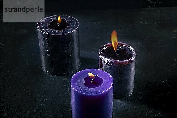 Burning candles on a dark background  mysterious ritual  Food photography