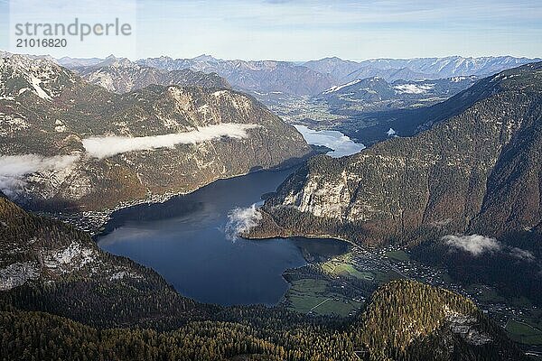 View from the Dachstein Krippenstein to Lake Hallstatt. Hallstatt on the left  Obertraun on the right. Autumn  good weather. Some clouds in the mountains. Lake Hallstatt  Salzkammergut  Upper Austria  Austria  Europe