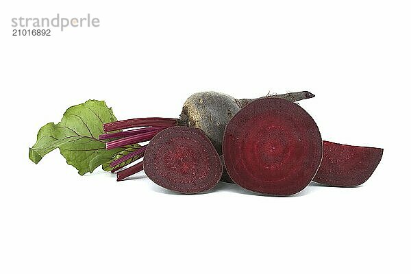 Raw whole and sliced baby beetroot isolated on white background