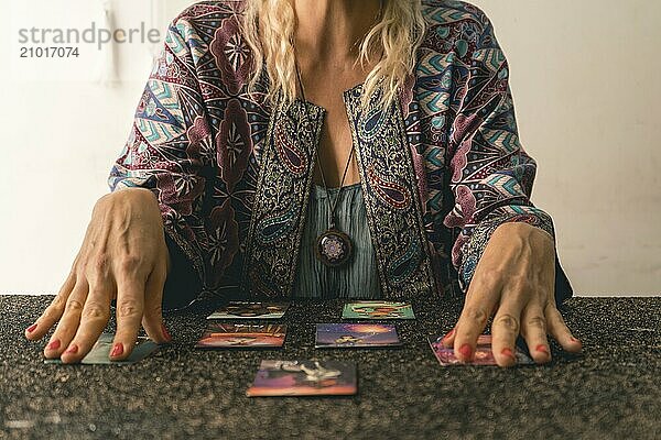 Close-up of a tarot reader's hands as she interprets the messages from the cards