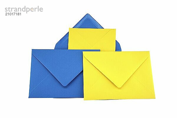 Collection of blue and yellow paper envelopes arranged against a white background