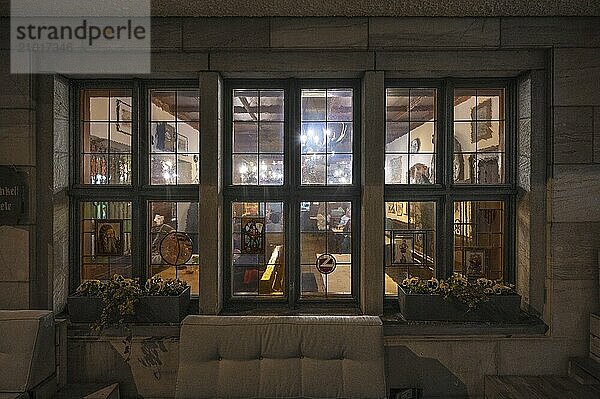 View through the window into a historic Franconian wine tavern  Nuremberg  Middle Franconia  Bavaria  Germany  Europe