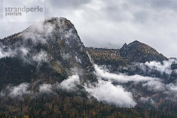 View of part of the Tennengebirge from Oberscheffau. The mountains are covered in clouds. Autumn. Salzburger Land  Upper Austria  Austria  Europe