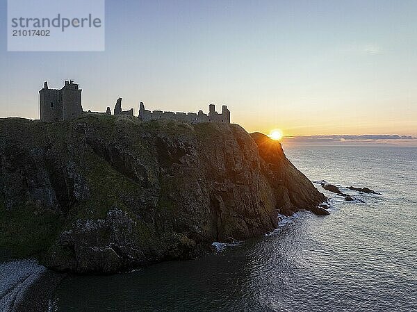 Dunnottar Castle  castle ruins at sunrise on the cliffs  drone shot  Stonehaven  Aberdeenshire  Scotland  Great Britain