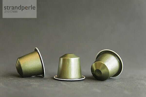 Beautiful colored coffee capsules on black background