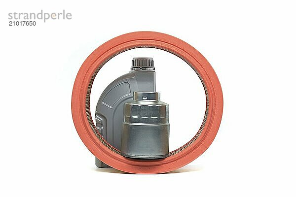 Grey plastic oil canister  orange air filter and silver metal oil filter isolated on white background  suggesting vehicle maintenance or part replacement