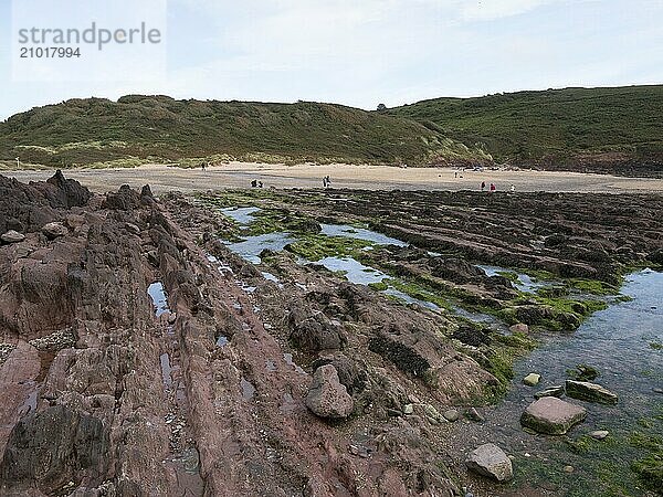 Tourists on the beach at Manorbier in Pembrokeshire  Wales  United Kingdom  Europe