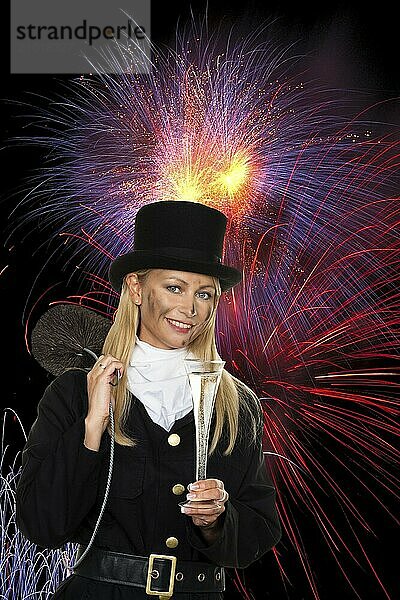 Female chimney sweep in front of fireworks on New Year's Eve  Lower Saxony  Federal Republic of Germany