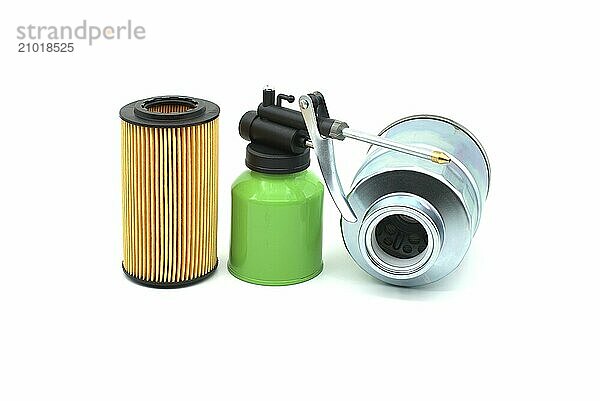 High pressure hand oiler pump machine and vehicle engine oil filters isolated on a white background. Car servicing  automotive industry and filter replacing maintenance