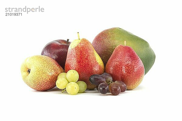 Assortment of fresh healthy fruits including multicolored mango  pears  red and green grapes and apple isolated on a white background