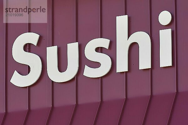 The lettering Sushi on a red background  plain  Toronto  Ontario  Canada  North America