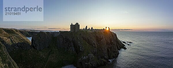 Dunnottar Castle  castle ruins at sunrise on the cliffs  drone shot  Stonehaven  Aberdeenshire  Scotland  Great Britain