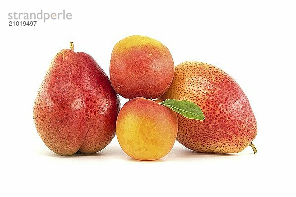 Whole ripe apricots and multicolored pears isolated on a white background. Multivitamin and juicy rich fruits