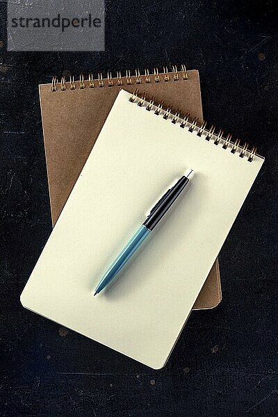 Notebook mockup with a pen  top shot on a black background  Food photography  Food photography