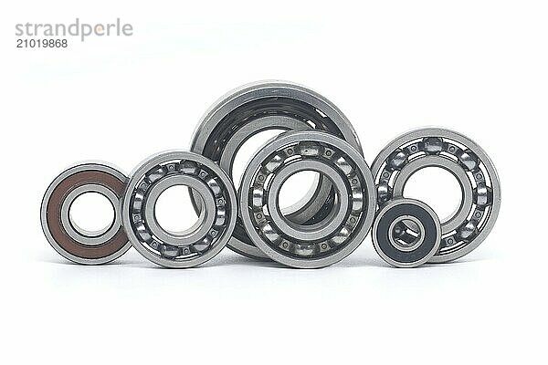 Array of bearings of varying sizes and types  including with and without sealing isolated on a white background