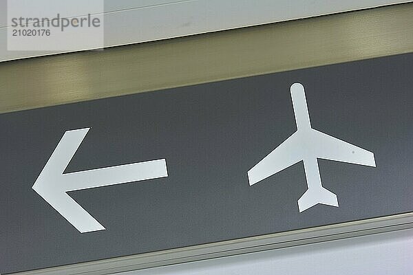 Symbolic image of an escalator and a directional arrow on a grey background  Toronto Airport  Ontario  Canada  North America