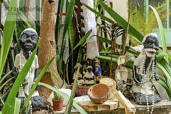 Religious altar with objects and entities of Umbanda among plants  Belo Horizonte  Minas Gerais  Brazil  South America