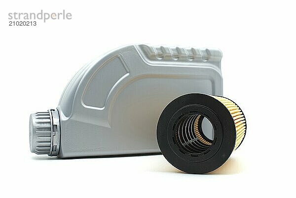 Vehicle engine oil filters elements and motor oil can isolated on a white background. Containers  plastic storage or oil and filter replacing maintenance