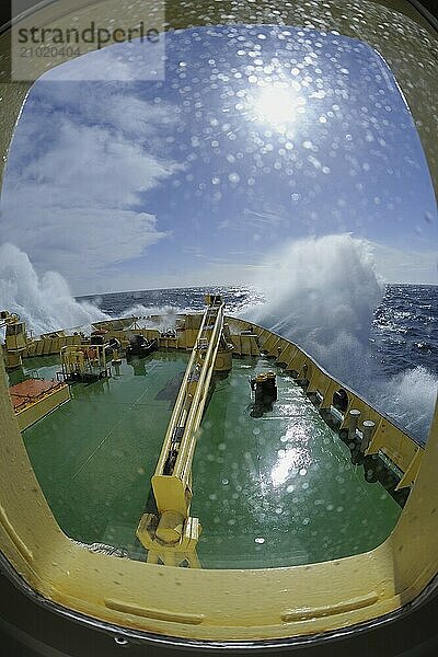 Bullseye with sunb look to bow of Icebreaker Kapitan Khlebnikov in rough seas at the way to Ushuaia  Drake passage  Southern Atlantic Ocean  Anartica  South America