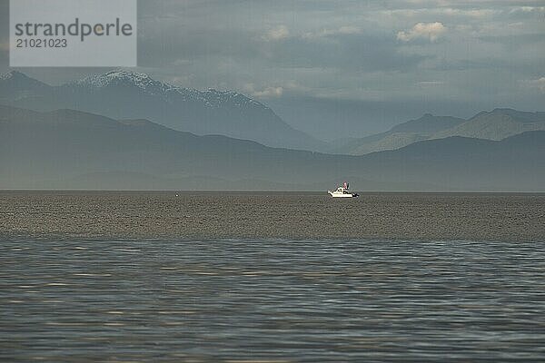 A motorboat in the Strait of Georgia off the coast of British Columbia  Canada  North America