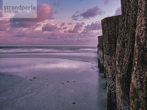 Groynes jutting into the sea. taken in zingst on the darss. the perspective is directed to the horizon