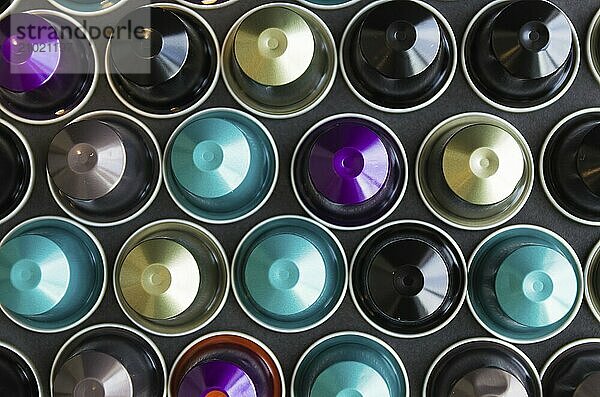 Beautiful colored coffee capsules on black background