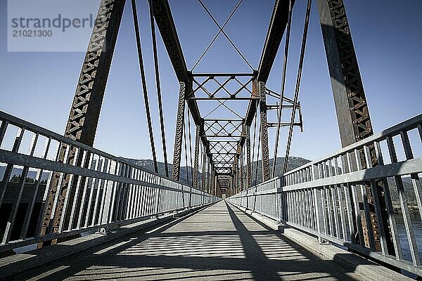 An old steel bridge repurposed into a walking path near Clark Fork  Idaho