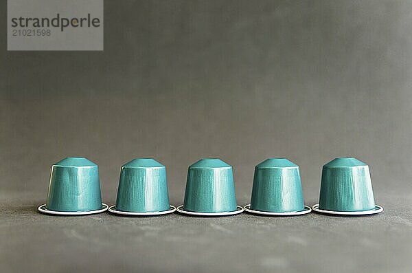 Beautiful colored coffee capsules on black background