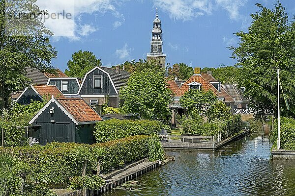 Canals and church tower of the Grote Kerk (Great Church) in Hindeloopen  province of Friesland  Netherlands