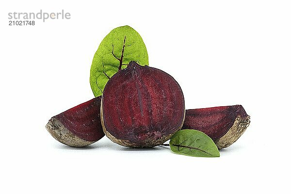 Collection slices of beetroot  complete with their green leaves isolated on white background