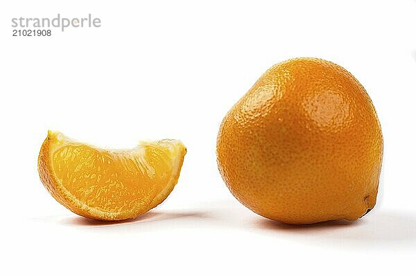 A concept photo of a whole cutie orange and an orange slice on a white background