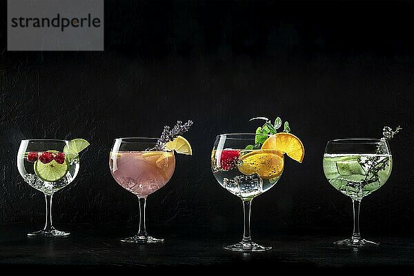 Fancy cocktails with fresh fruit. Gin and tonic drinks with ice at a party  on a black background  with copy space  Food photography  Food photography