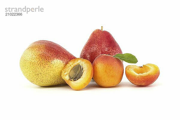 Whole and halved ripe apricots  multicolored pears isolated on a white background. Multivitamin and juicy rich fruits