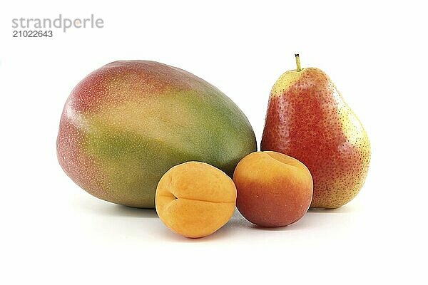 Whole ripe apricot  pear and mango fruits isolated on a white background