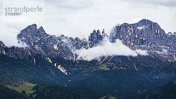 The peaks of the rose garden  shrouded in mist  drone shot  Dolomites  Autonomous Province of Bolzano  South Tyrol  Italy  Europe