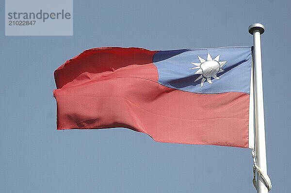 The flag of Taiwan against blue sky