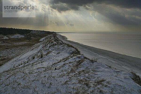 Dramatic sunset at the high dune on the darss. Viewpoint in the national park. Beach  Baltic Sea  sky and sea. Nature shot in Germany